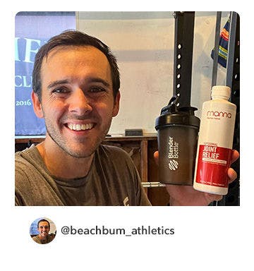 A manna customer holding up a bottle of Liposomal Joint Relief 4