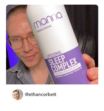 A manna customer holding up a bottle of Liposomal Sleep Complex 2